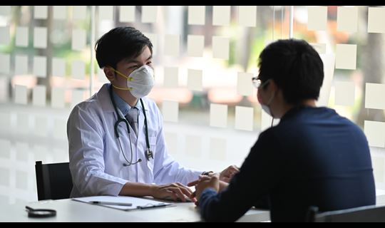 Doctor talking to patient
