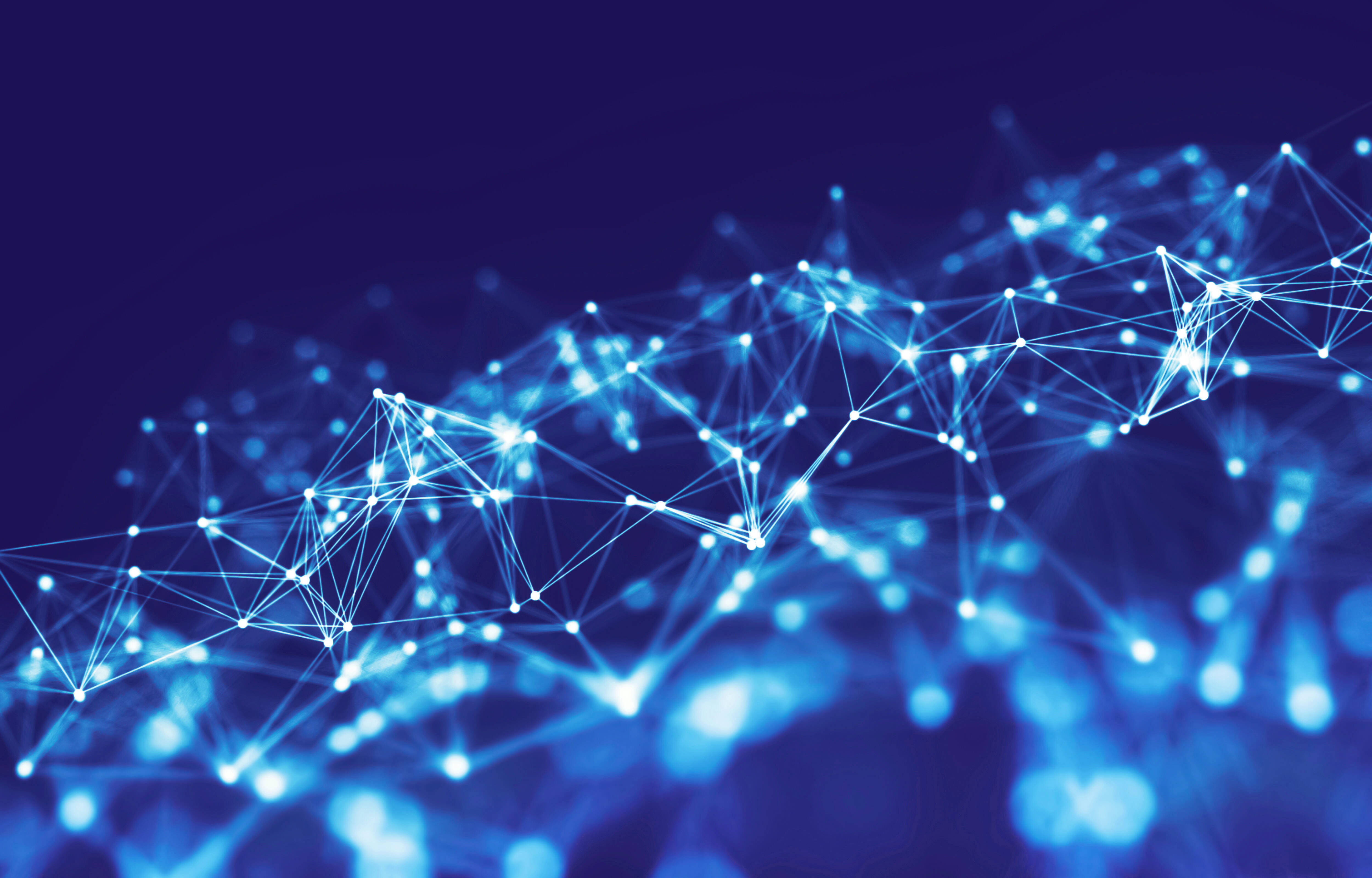 Abstract graphic of white network of lights on navy blue background