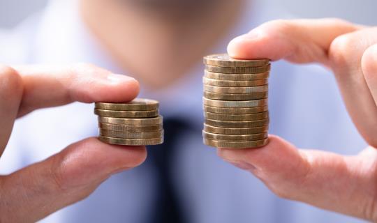 Hands holding coins