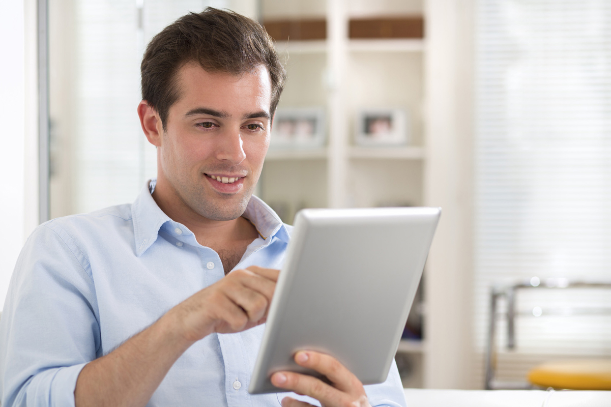 Young man taking survey on iPad